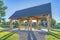 Pavilion with three picnic tables in a public park at Daybreak residential community in Utah