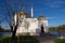 Pavilion `Turkish bath` with gilded domes, standing on the shore of lake Catherine Park. Against a blue sky with clouds