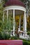 Pavilion with white columns and a burgundy roof