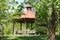 Pavilion with wood chairs in spring park