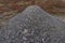 Paving gravel heap pile mound of building pavement construction material small stones pebble of gray quartz