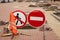 Paving slabs laying works. Prohibitory road signs