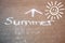 paving slabs, walking, cycling path, pedestrian path with text summer and arrow, sun, drawn with white chalk, change seasons,