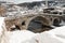 paving stones bridge and bistrica river of city of prizren in Kosovo at winter season