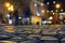 Paving stones with night lights, night city abstract background and texture