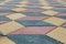 Paving tiles with low angle in the form of cubes of different colors perspective