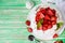 Pavlov`s cake with strawberries and cream on a rustic background, top view
