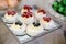 Pavlova cakes meringue dessert decorated with berries, close up