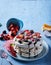 Pavlova dessert with layered cream and meringue