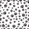 Paw print seamless pattern on a white background. Vector illustration