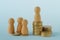 Pawns with stacks of coins - Concept of social and economic inequality