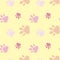 Paws pattern. Silhouettes of paws, cat s feet, dog s footprint. Pastel pink, nude on a yellow background. Seamless