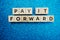 Pay It Forward alphabet letter on blue glitter background