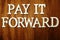 Pay it Forward  word alphabet letters on wooden background