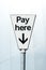 Pay Here sign. Pay and display carpark