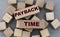 PAYBACK TIME - words on wooden bars on cubes on a gray background