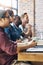 Paying keen attention to new information. a group of businesspeople listening to a presentation in an office.