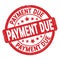 PAYMENT DUE text written on red round stamp sign