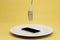 payment for food via smartphone. a plate with a smartphone and a plug on a yellow background. 3D render