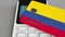 Payment or POS terminal with credit card featuring flag of Colombia. Colombian retail commerce or banking system