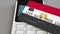 Payment or POS terminal with credit card featuring flag of Egypt. Egyptian retail commerce or banking system conceptual
