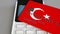 Payment or POS terminal with credit card featuring flag of Turkey. Turkish retail commerce or banking system conceptual