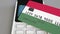 Payment terminal with credit card featuring flag of Hungary. Hungarian national banking system conceptual 3D animation