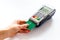 Payments in shops. Hand insert bank card in terminal on white background