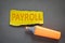 PAYROLL. Business concept. Text on torn, colored paper on corrugated background