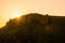 Paysage of hills and silhouettes of people on a sundown