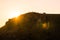 Paysage of hills and silhouettes of people on a sundown