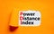 PDI power distance index symbol. Concept words PDI power distance index on white paper on a beautiful orange background. Business