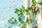 pea flowers on a blue vintage background. cracked paint. plant loach flies a wooden log