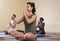 Peace begins within. Full length shot of a group of young people meditating and practicing yoga together inside a yoga