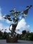 Peace statue in Normandy, France - silver woman holding dove