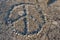 Peace symbol shaped with pebbles Stockholm archipelago