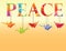 Peace text with colorful origami paper cranes
