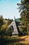 Peaceful abandoned old cottage at summer sunset in the mountains. Country house in the village. Wooden cottage on the mountain