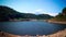 Peaceful Atmosphere Of Natural Lake Water Ripple Of Titab Ularan Large Dam Between The Hills On A Sunny Day