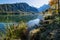 Peaceful autumn Alps mountain lake with clear transparent water and reflections. Almsee lake, Upper Austria