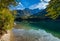 Peaceful autumn Alps mountain lake with clear transparent water and reflections. Langbathseen lake, Upper Austria