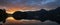 Peaceful autumn Alps mountain lake. Sunrise Wolfgangsee lake view, St. Wolfgang im Salzkammergut, Upper Austria