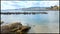 Peaceful beach view towards birds on a pier