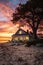 peaceful beachfront cottage at sunset