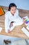 Peaceful businesswoman doing yoga sitting on floor