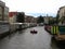 A peaceful canal behind flower market full of water in Amsterdam