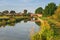 Peaceful Canal and Tow Path with Small Brick Bridge