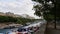 Peaceful cityscape with the promenade of Canal Saint-Martin in the east of Paris downtown with docking boats.