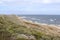Peaceful coastal landscape featuring a sweeping view of an empty beach. Cape of Good Hope.