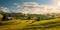 peaceful countryside Labor Day background featuring farms, barns, and rolling hills, illustrating the importance of